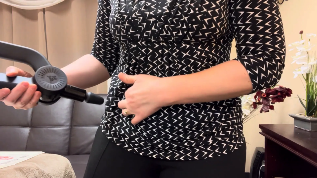 Demonstration of using a massage gun on tight hip flexors Massage tight hip flexors