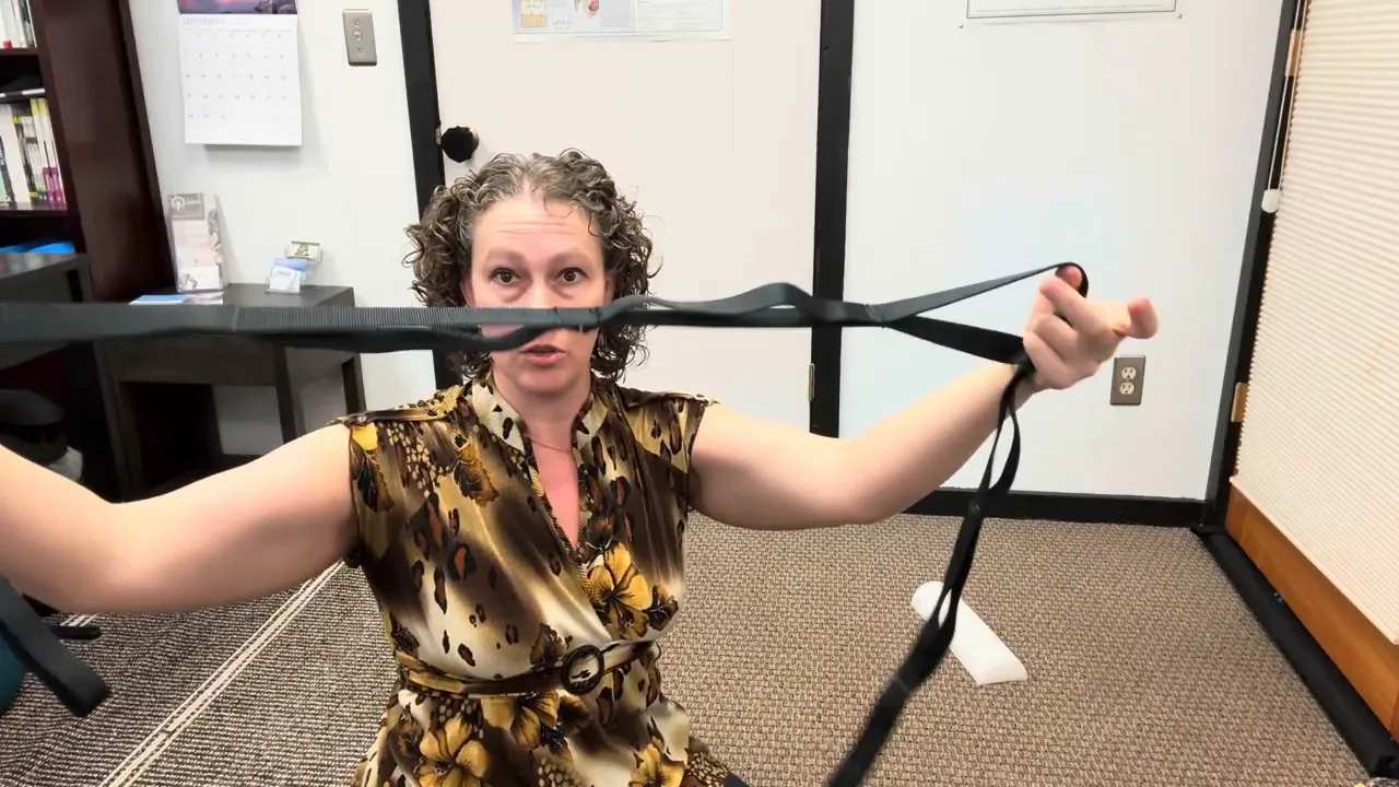 Emily holding the strap with foot and hand loops