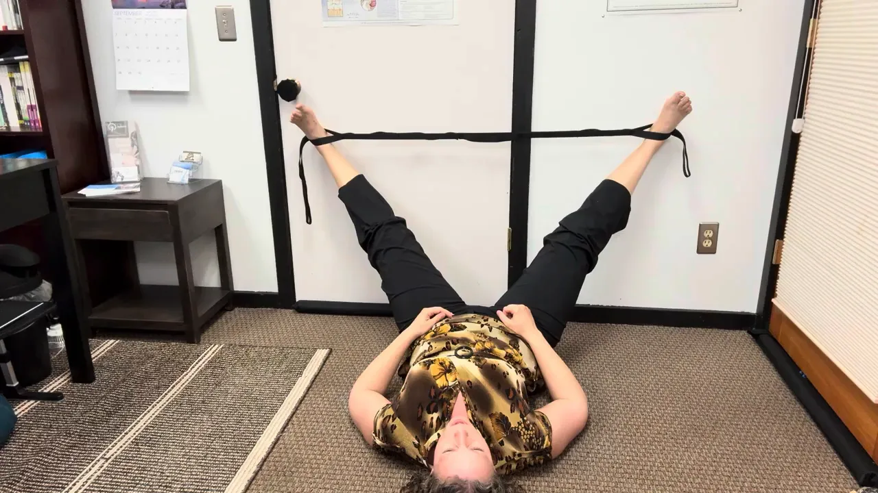 Feet in the strap with low back supported, legs opening