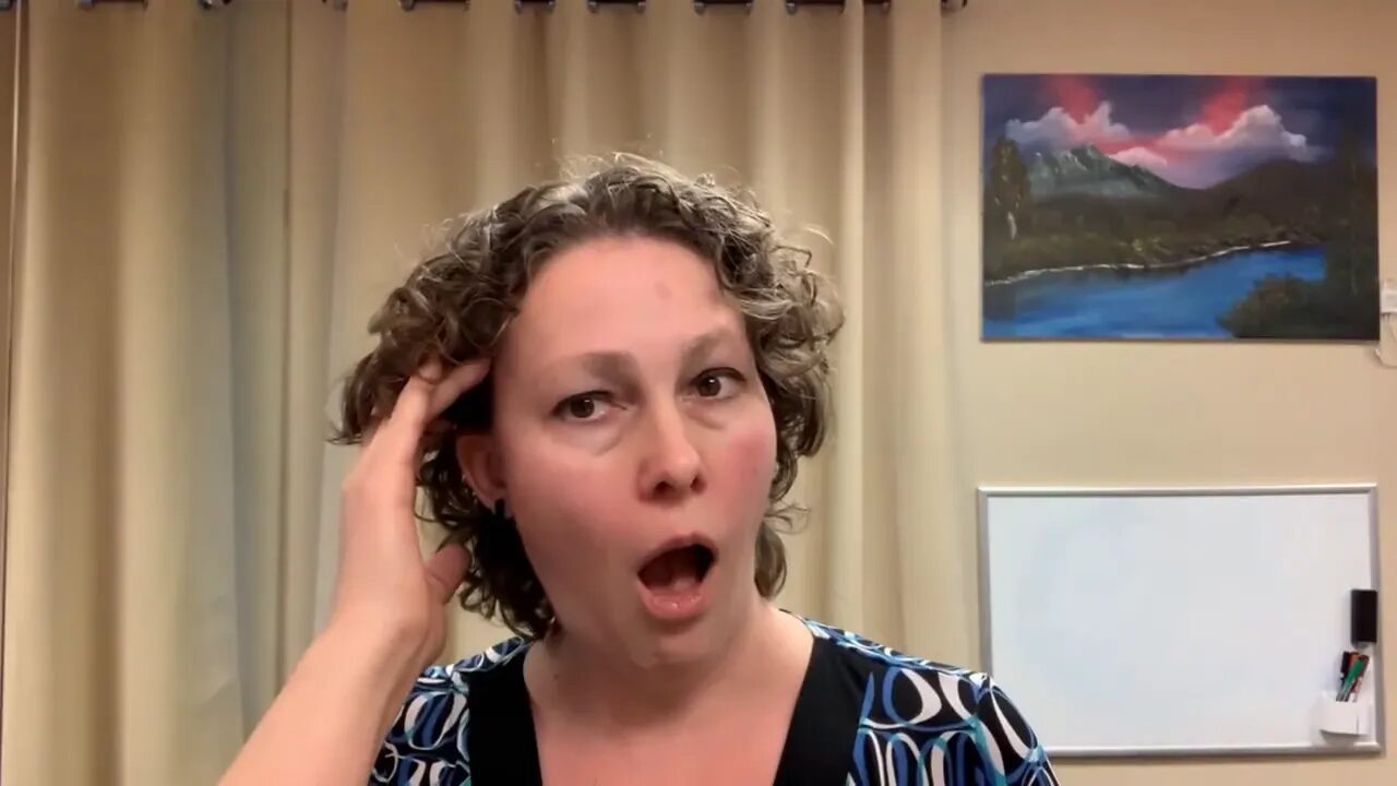 Hand behind ear with jaw open showing temporalis movement for TMJ self-massage