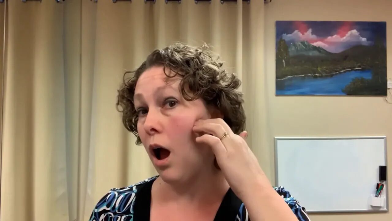Open mouth with fingers pressing under the cheekbone to access masseter under zygomatic arch