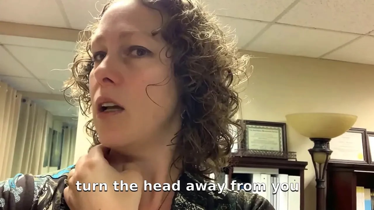 demonstration of turning head away with thumb on the sternocleidomastoid muscle